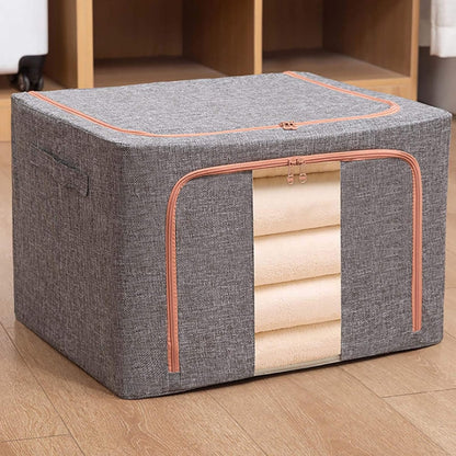 Cutie depozitare Macvi® 24L pliabila din material textil cu fermoar si fereastra transparenta cu cadru metalic pentru organizare eficienta, organizator pentru haine si articole casnice