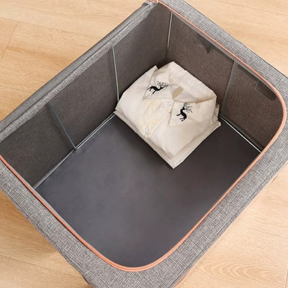 Cutie depozitare Macvi® 66L pliabila din material textil cu fermoar, fereastra transparenta si cadru metalic, organizator incapator pentru haine si articole casnice