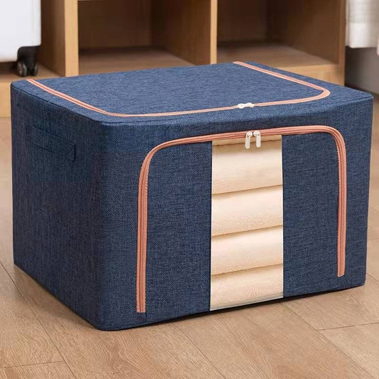 Cutie depozitare Macvi® 66L pliabila din material textil cu fermoar, fereastra transparenta si cadru metalic, organizator incapator pentru haine si articole casnice